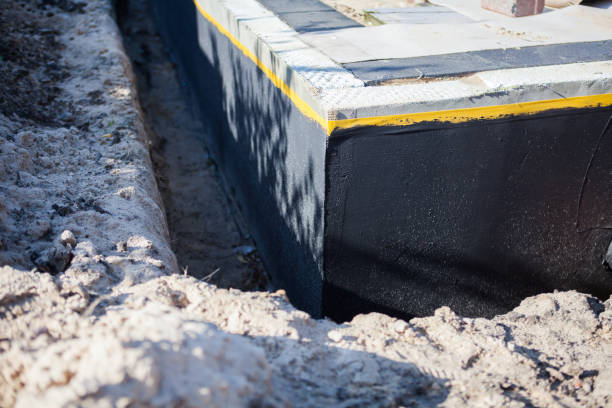 Professional Basement Waterproofing technician working in Grammer, IN